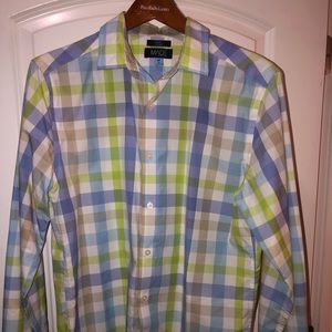 This is a Made by Cam Newton, button down plaid design shirt. Slim fitting plaid